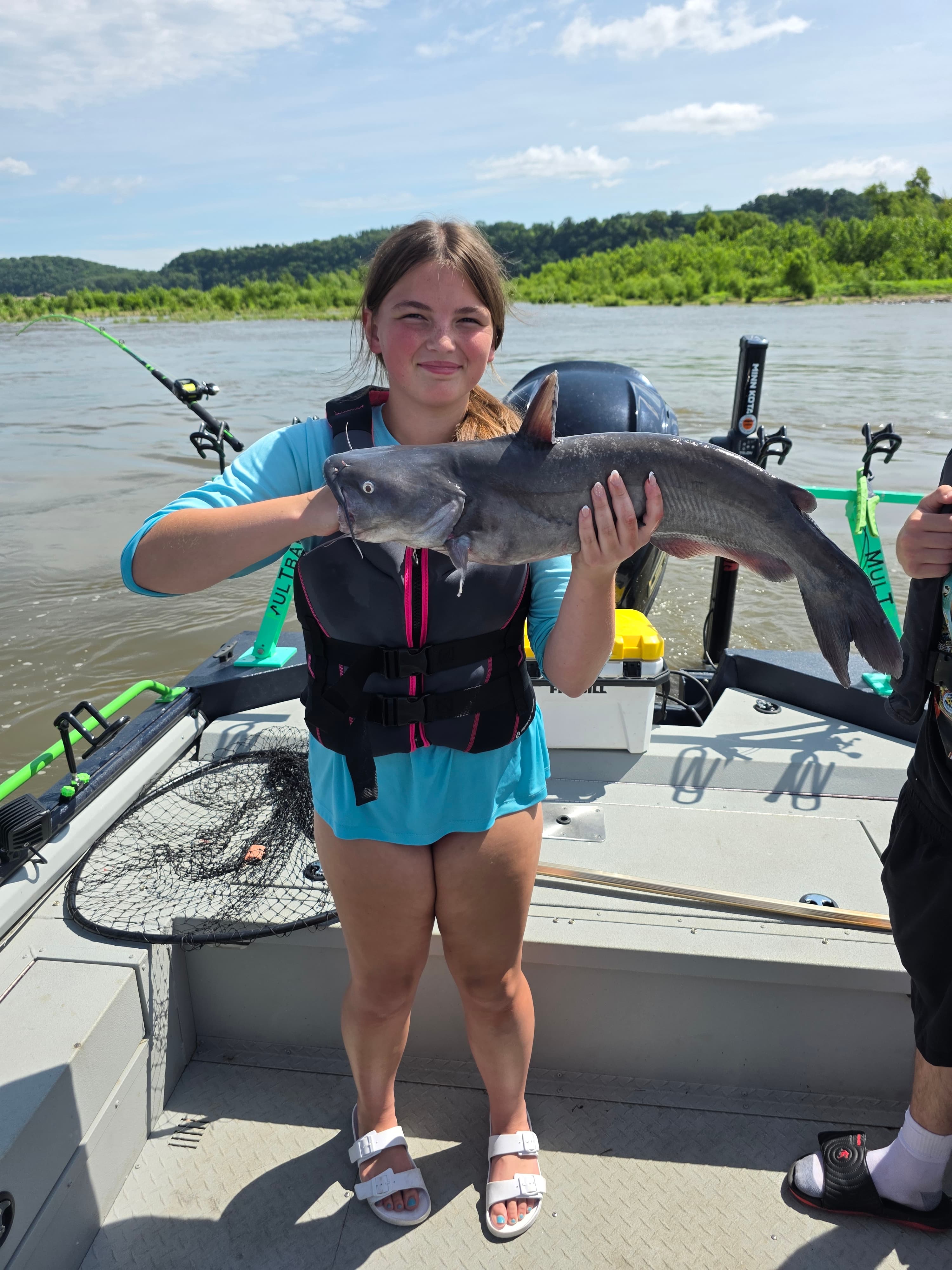Young angler with a nice catfish catch