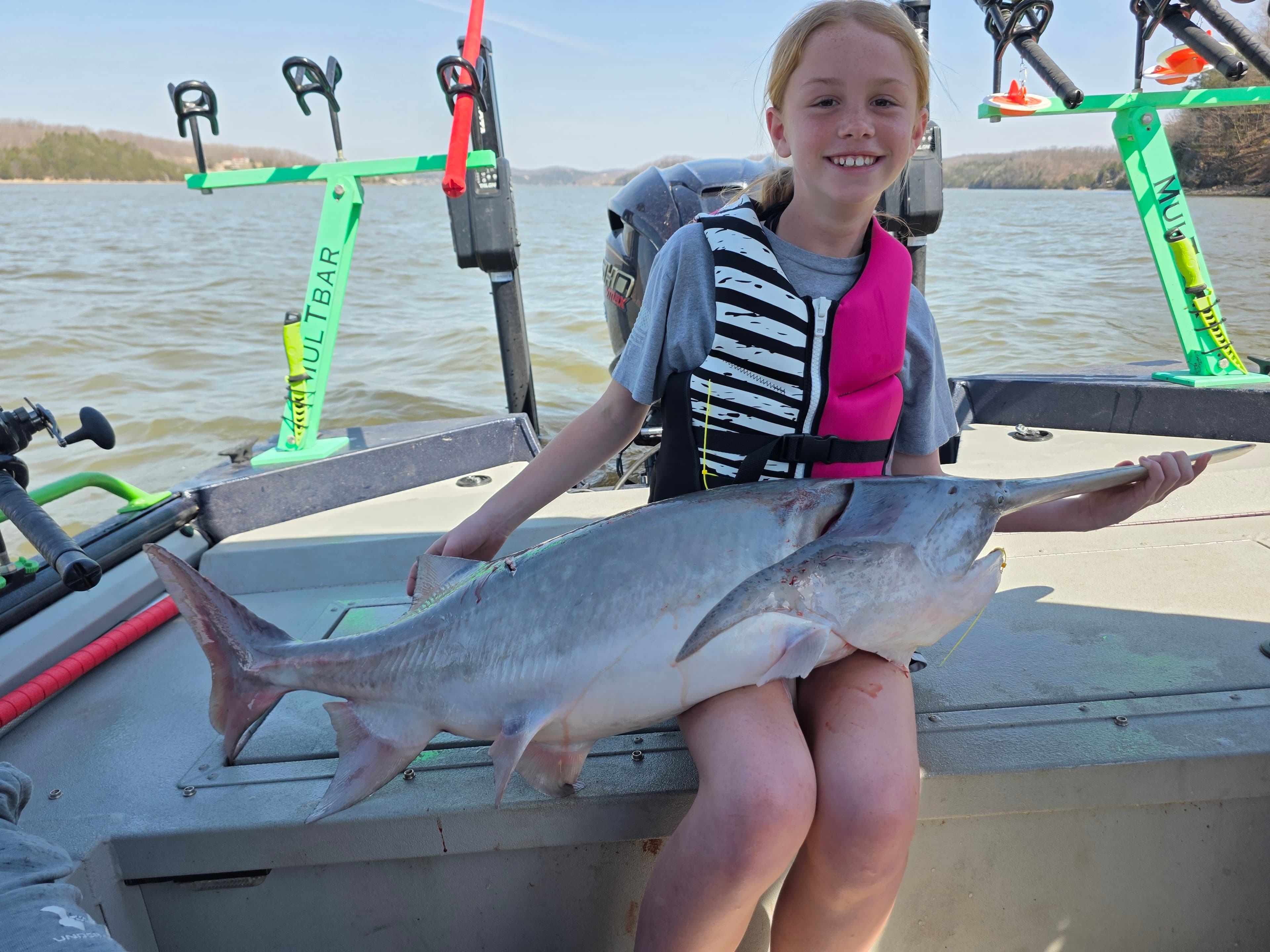 Young angler with her trophy spoonbill