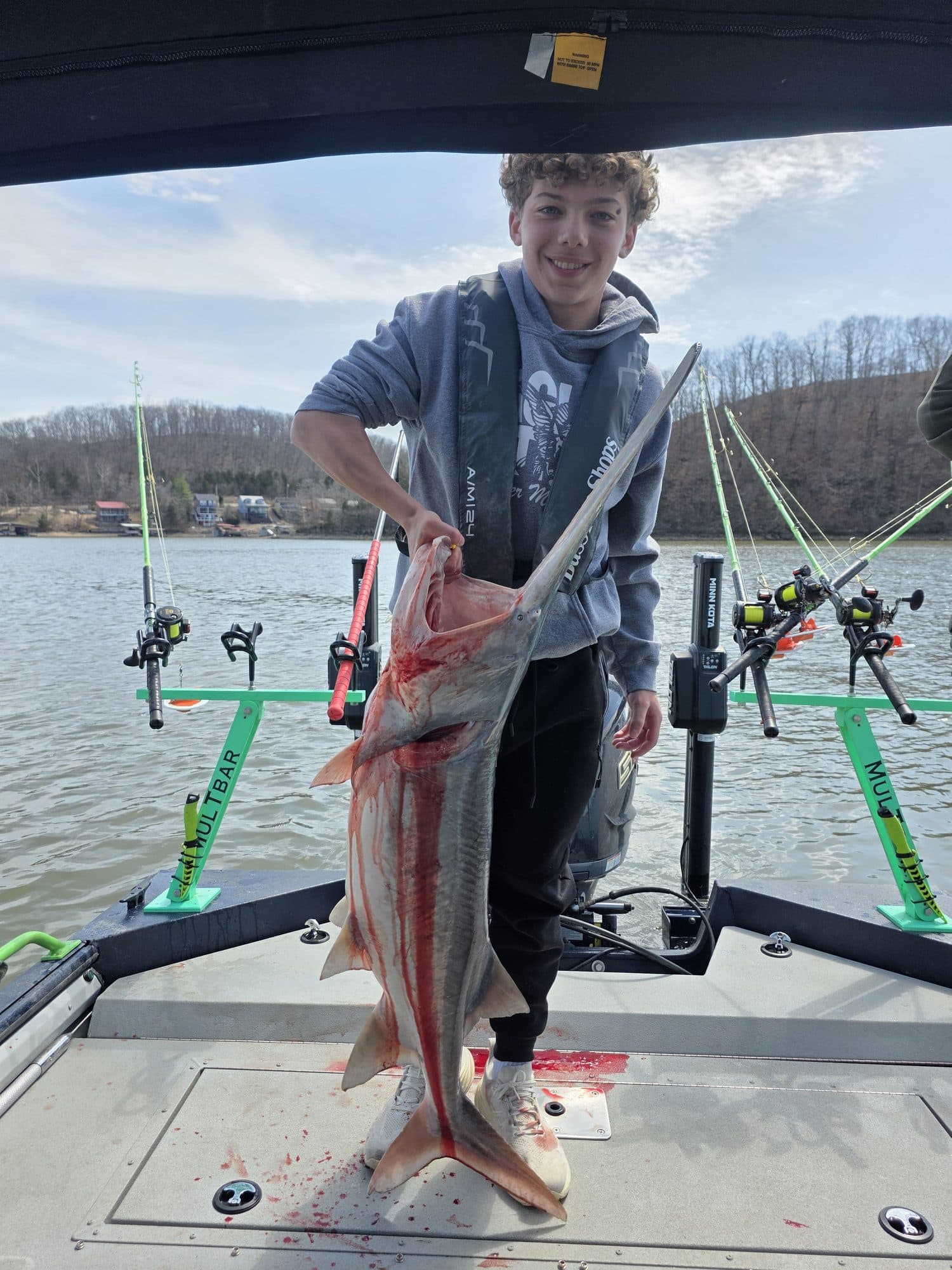 Young angler with a big catch