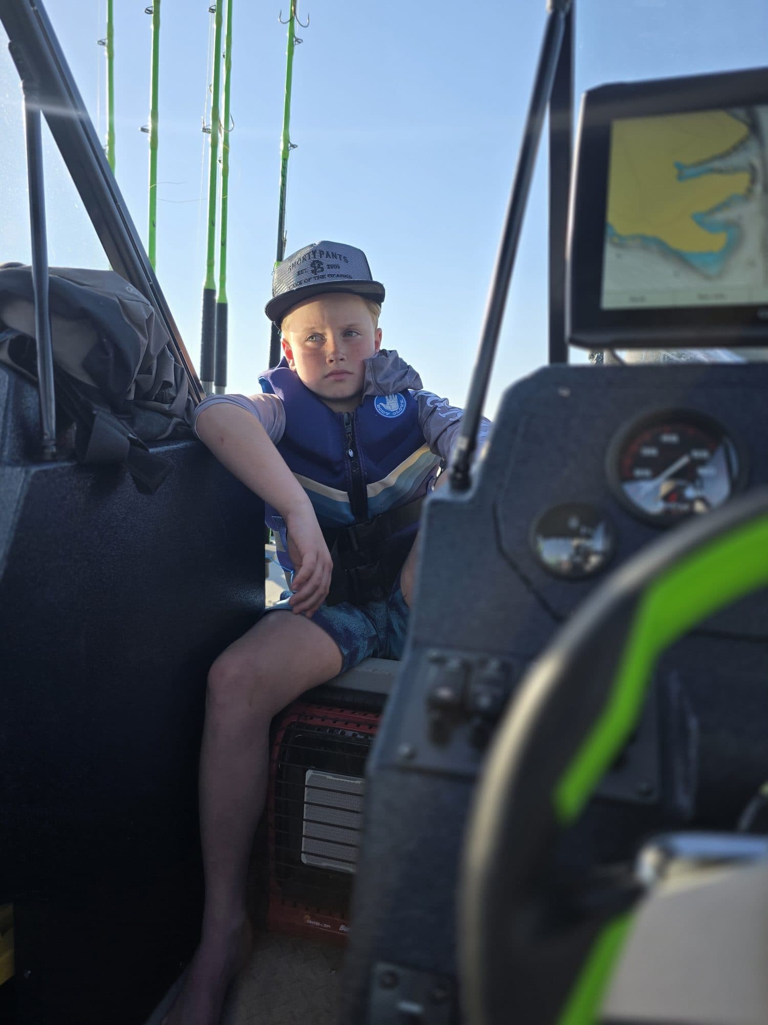 Young angler at the helm