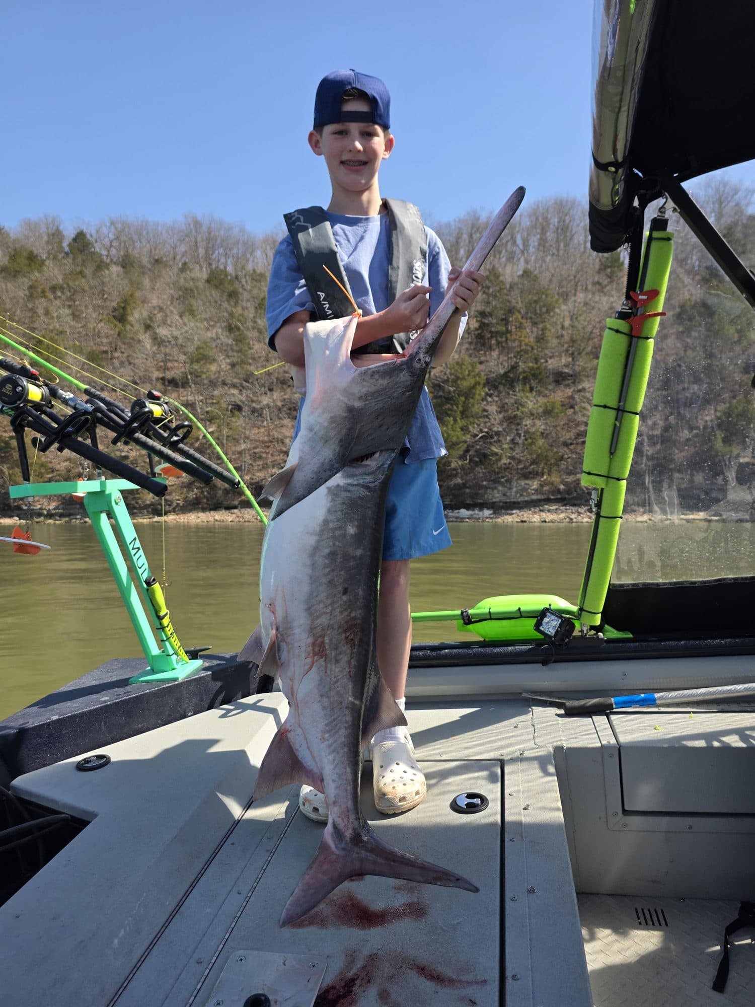 Young angler with a trophy catch