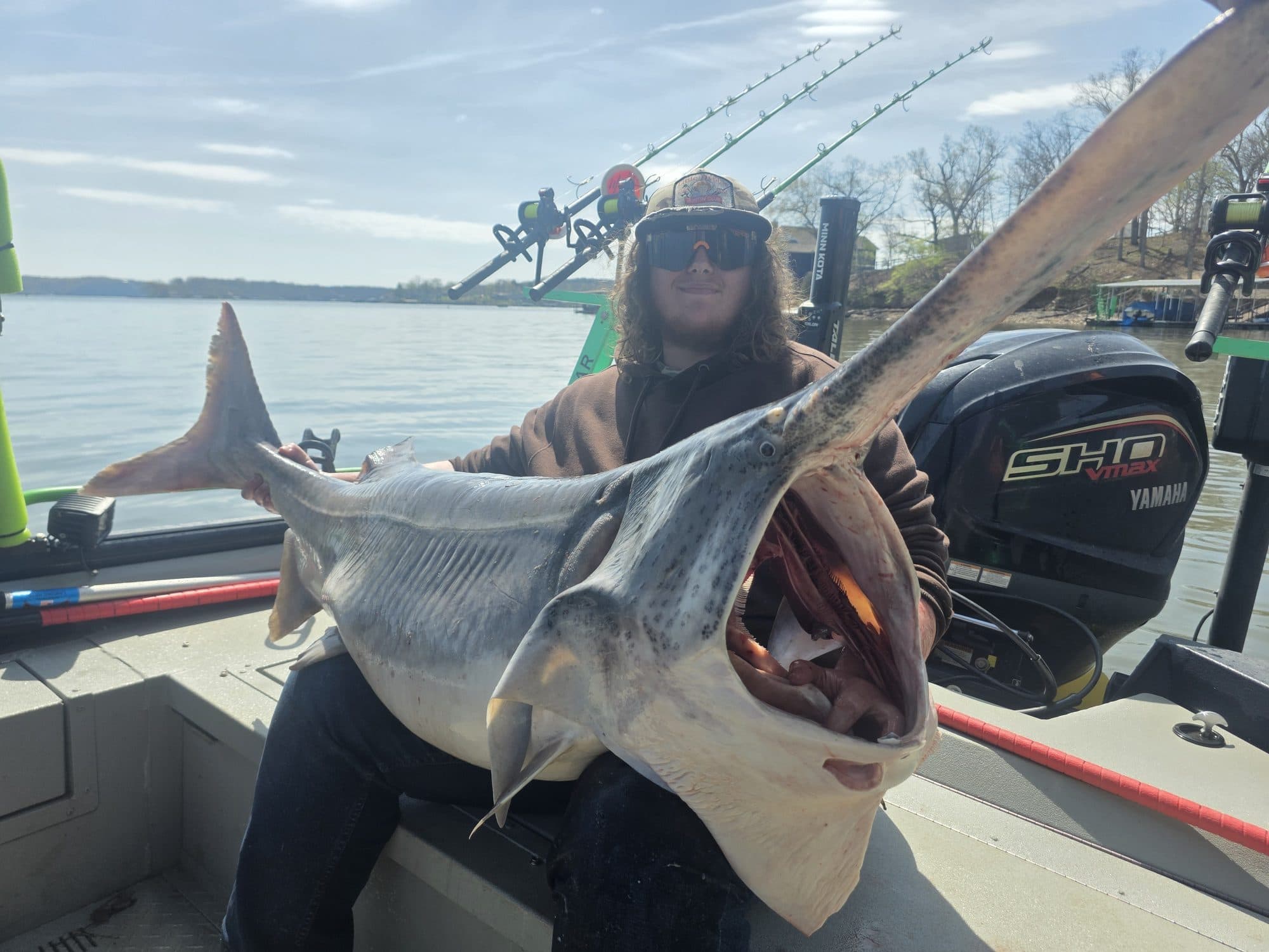 Angler with a trophy spoonbill catch